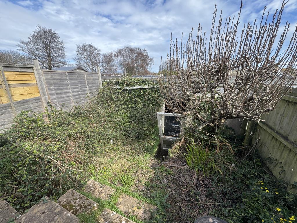 Lot: 157 - TWO-BEDROOM LINKED BUNGALOW FOR UPDATING AND REPAIR - Rear garden